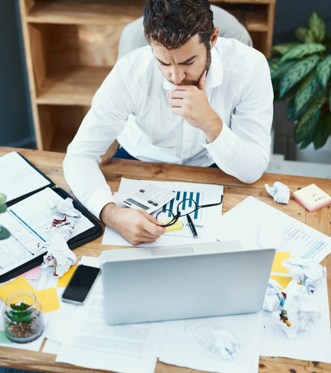 Businessman, tech and serious with planning as accountant, professional or administration in financial firm. Male person, office and corporate with ideas for tax returns, investment or finance audit.